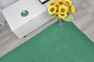 Bawełniany dywan, kolor zielony.